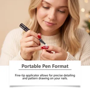 Close-up of portable nail art pen drawing a precise snowflake pattern on red nails