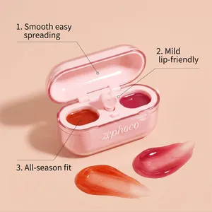 Nahaufnahme von zweifarbigen Jelly-Lipgloss-Proben in den Farben Orange und Rosérot