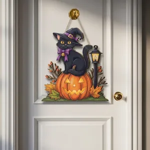 Decorative Halloween door hanger featuring a black cat and carved pumpkin design