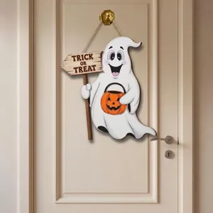 View of Halloween ghost hanger with Trick or Treat sign on a minimalist white door
