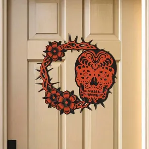 Macro view of detailed laser-cut wooden Halloween skull wreath hanging on a door