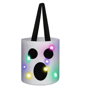 Detailed view of white Halloween ghost candy bucket featuring colorful glowing LED lights