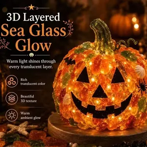 Close-up of lighted sea glass Halloween pumpkin showing rich 3D texture and warm glow.