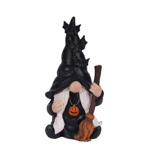 Detailed view of Halloween wizard gnome resin ornament with pumpkin necklace and broom