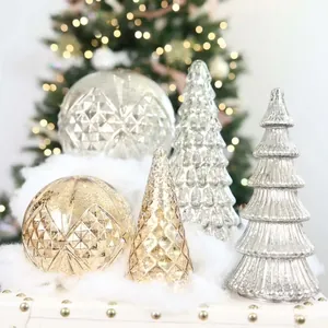Detailed macro view of textured glass Christmas tree and ball ornaments in gold and silver