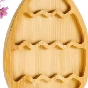 Close-up detail of bamboo Easter egg shaped snack tray with wavy internal dividers