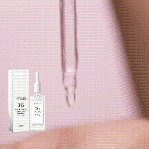 Close-up detail of serum dropper and liquid texture for dark spot correcting skin care.