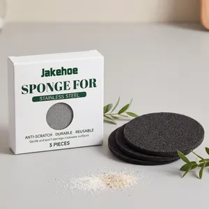 Detail shot of JAKEHOE reusable black cleaning sponges for stainless steel cookware sets.