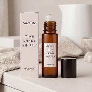 Viareline essential oil roller bottle and pink packaging on a minimalist lifestyle background.