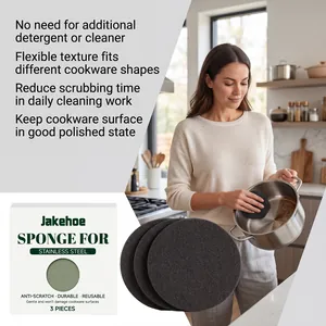 Woman cleaning a stainless steel pot with a round Jakehoe sponge in a kitchen setting