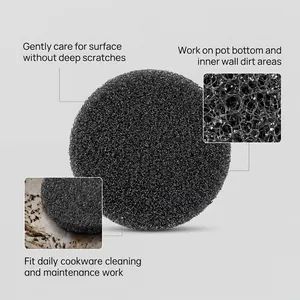 Macro detail and usage scene of a black mesh sponge for cookware cleaning and care.