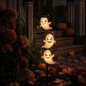 Solar powered Halloween garden stake light with three glowing ghosts and pumpkin