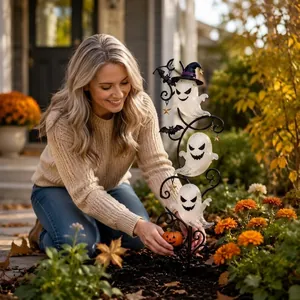 Solar-powered Halloween ghost garden stake light featuring glowing ghosts and pumpkin