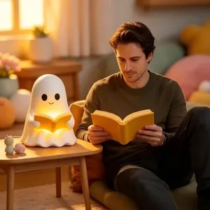 Cozy lifestyle view of a cute ghost-shaped reading book night light on a side table.