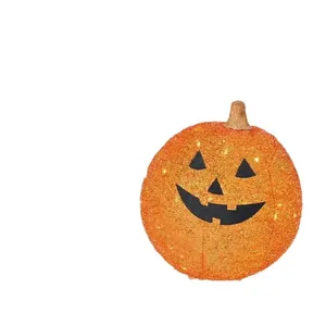 Grote oranje glitter Halloween pompoenlamp voor buiten met een lichtgevend gezicht