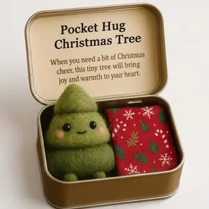 Cute Christmas-themed pocket hug gift featuring a felt tree in a stylish gold tin box