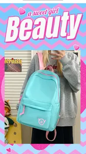 Large capacity light blue school backpack for teenage girls featuring pink accents