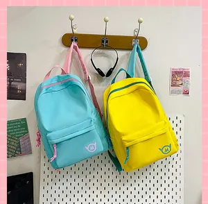 Detailed view of lightweight blue and yellow backpacks in a stylish setting