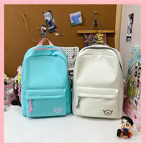 Minimalist turquoise and beige high-capacity backpacks for students in desk setting