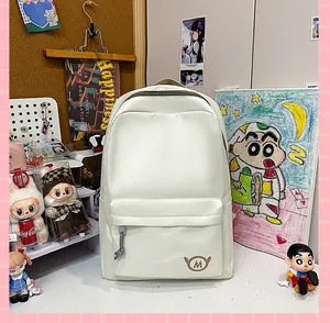 Detailed macro view of a cream-colored student backpack in a cozy study desk setting.