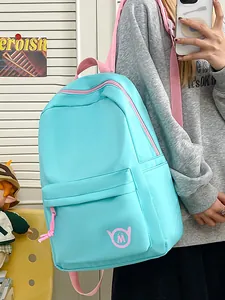Stylish light blue large capacity school backpack for girls featuring pink straps