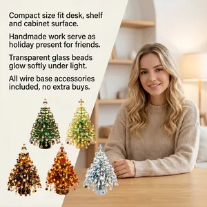Handmade DIY glass bead Christmas tree kit with various festive designs and colors.
