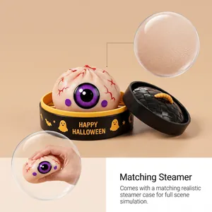 Detailed view of Halloween eyeball bun squishy toy and its matching realistic steamer case.