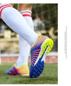 Professional detailed view of colorful TF/AG soccer shoes with textured upper and studs