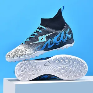 Close-up of boys' turf soccer shoes featuring a blue flame pattern and knit collar
