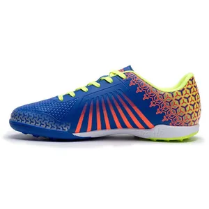 Blue and orange professional TF turf soccer shoes for men and youth with vibrant pattern