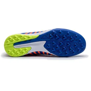 Blue and orange striped soccer cleats with lime green TF turf soleplate details