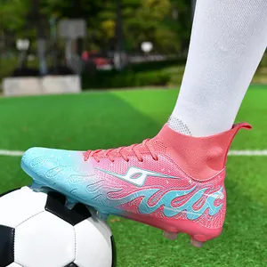 Professional youth pink and blue gradient high-top soccer cleats for training on grass