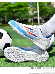 Detailed view of colorful soccer shoes featuring turf studs and breathable mesh