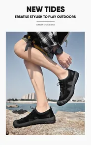Vue latérale de chaussures d'extérieur en maille respirante pour hommes noires
