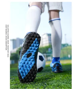 Detailed macro view of the wear-resistant rubber sole on children's soccer sneakers
