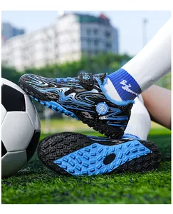 Detailed macro view of fleece-lined blue kids soccer shoes for outdoor turf training