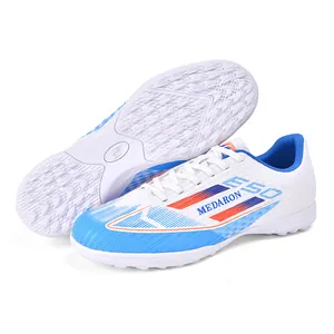 Colorful soccer shoes with breathable design and turf studs for professional sports training.
