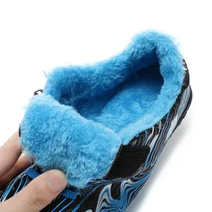 Children's winter soccer cleats featuring warm blue fleece lining and patterned upper