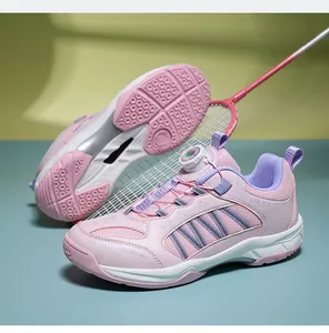 Detailed side view of pink children badminton shoes featuring a quick-dial closure system