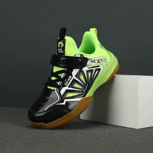 Professional kids' badminton shoes with breathable mesh and non-slip soles in neon green.