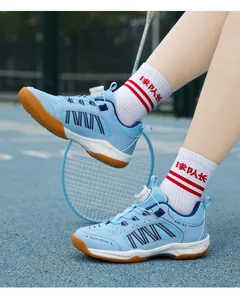 Close-up of blue kids badminton shoes with rotating buckle and breathable mesh