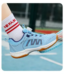 Children's blue badminton shoes with rotary button and breathable mesh detail