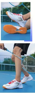 Professional white badminton shoes with red laces and non-slip rubber soles