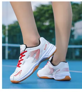 Professional breathable mesh badminton shoes with non-slip gum rubber sole and red laces.