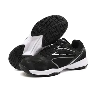 Black and white badminton shoes showing side profile and anti-slip rubber sole detail