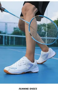 Breathable professional white badminton shoes with non-slip gum rubber sole in action