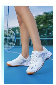 Close-up of lightweight breathable white badminton shoes with non-slip gum sole