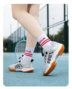 Action shot of children's badminton shoes with rotating buckle on a court.