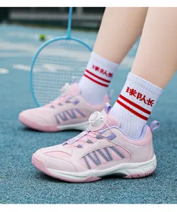 Close-up of pink children's badminton shoes with breathable mesh and rotary dial