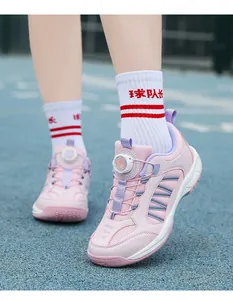 Pink children's badminton shoes with breathable mesh and innovative rotating buckle design